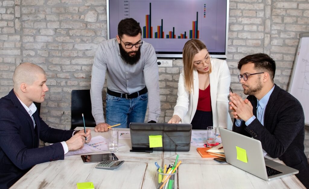 Successful business partners having a meeting and discussing new project ideas in a modern office